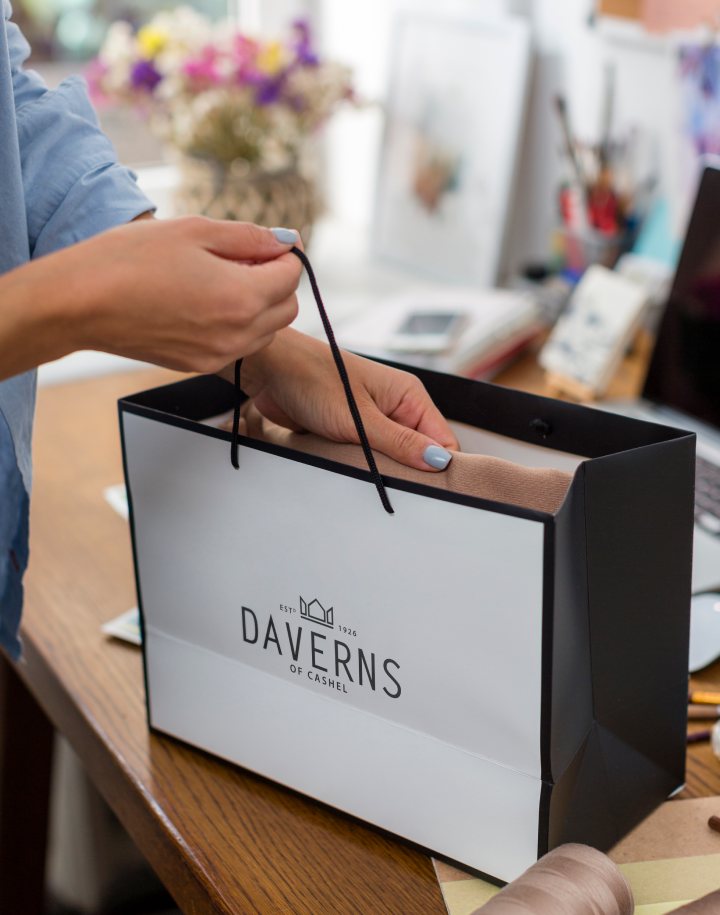 Daverns carrier bag being packed at the counter