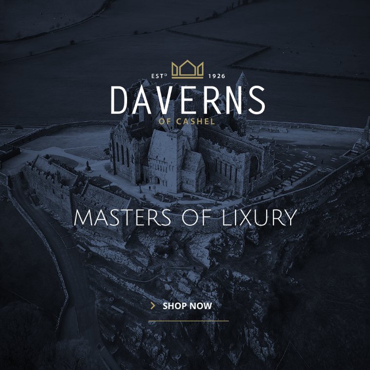 Daverns social post: aerial Rock of Cashel at dusk with the full lockup centred